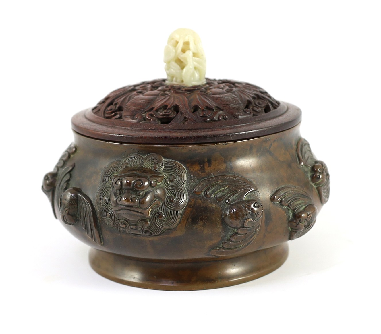 A large Chinese bronze ding censer, the wood cover with pale celadon jade finial, 22cm across